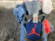 Close-up of the tongue showing Jordan branding, dark laces, and red logo details.
