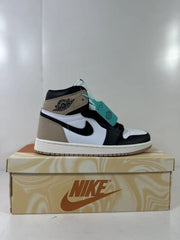 Side profile of a single brown, black, and white high-top sneaker displayed on a shoe box.