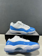Two white and blue low-top sneakers shown from side and outsole angles, highlighting the glossy blue panels and translucent sole.