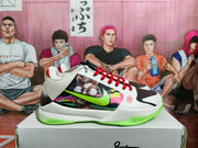 Side view of white Nike basketball sneakers with fluorescent green accents, red laces, and a colorful graphic side panel.