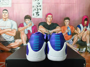 Rear view of the sneakers showing purple heel panels, turquoise accents, and white heel sections.