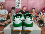 Rear view showing green heel panels, white midsoles, and yellow outsole sections.