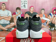 Rear view showing the padded black collars, Flight heel lettering, white heel sections, and Nike logos.