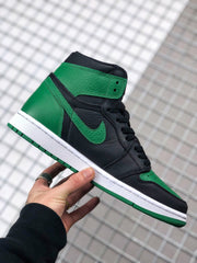 Handheld side view showing the high-top silhouette, black laces, green accents, and white midsole.