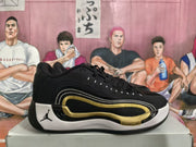 Side profile of a black sneaker with white and gold curved accents and a visible Cushlon marking.