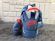 Rear view showing the red heel branding, pull tab, and ankle construction.