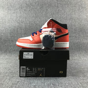 Photographed sneaker on a box labeled Air Jordan 1 MID (GS), with size 5Y and EU 35.5 visible, plus spare laces.