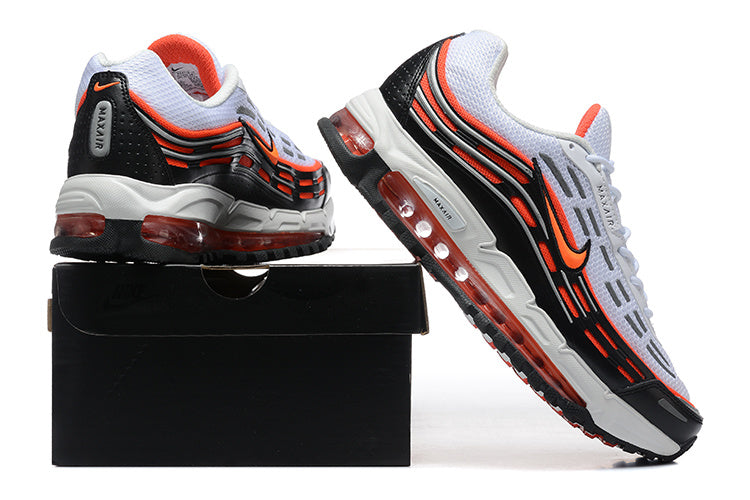 Nike sneakers shown from the heel and side, with white, black, and bright orange details and a visible-cushioning midsole.