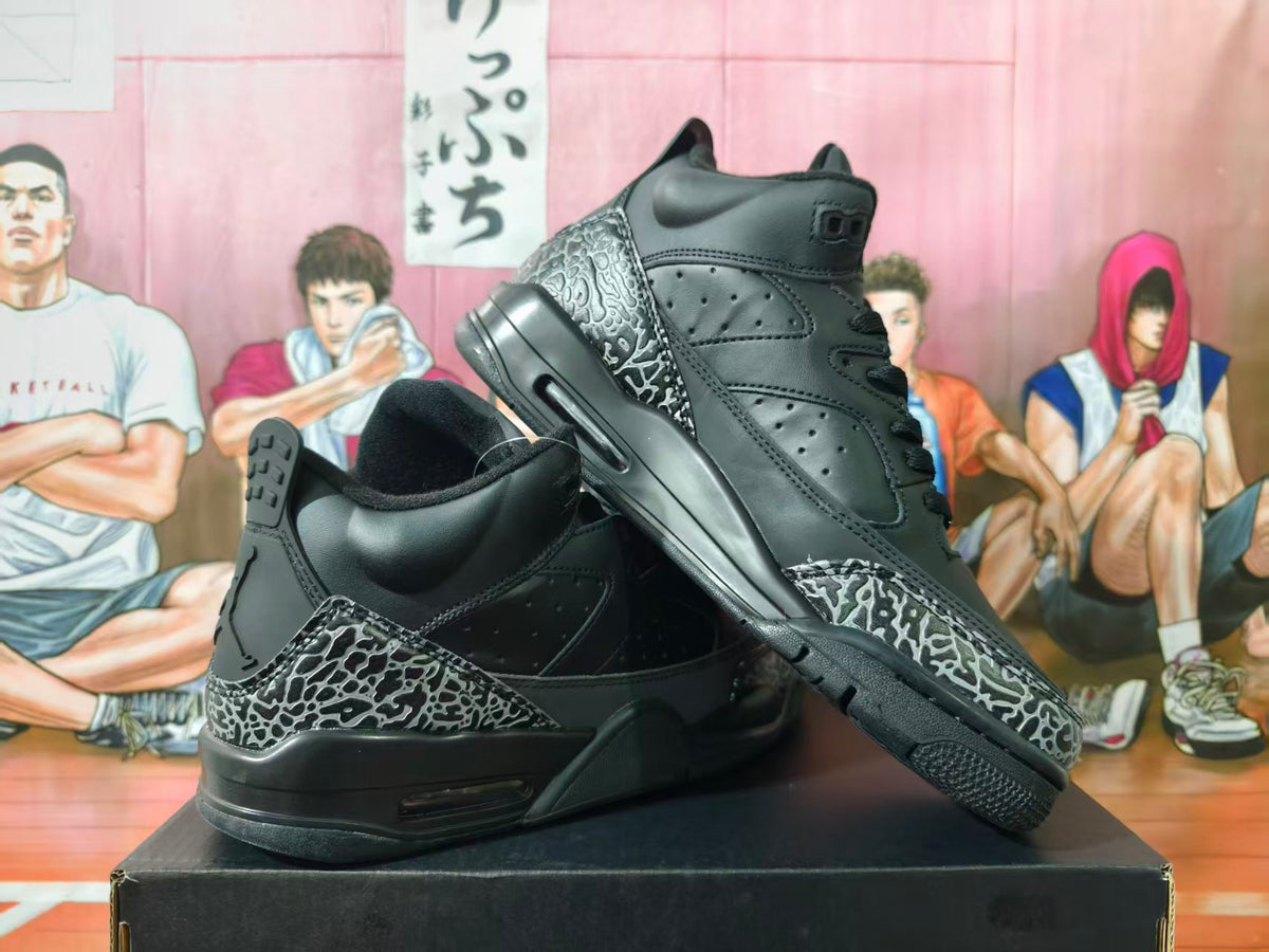 Pair of black high-top Jordan sneakers with gray elephant-print overlays, shown from the side and at an angle