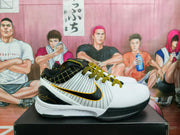 Side view showing the black Swoosh with gold outline and striped white panels
