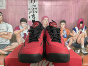 Front view of red and black Nike sneakers with black laces