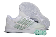 Side view of white and silver Nike Sabrina 3 shoes with patterned outsole visible