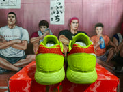 Rear view showing the bright yellow heel panels, red patterned collar sections, and embossed Nike branding.