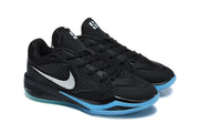 Pair of black lace-up basketball shoes with silver Swooshes and blue outsole accents