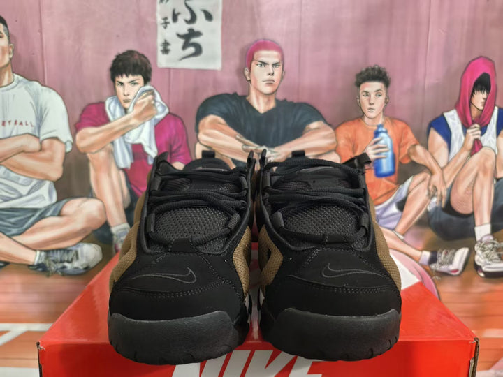 Front view of brown and black Nike sneakers with black laces and toe detailing on a Nike shoebox.