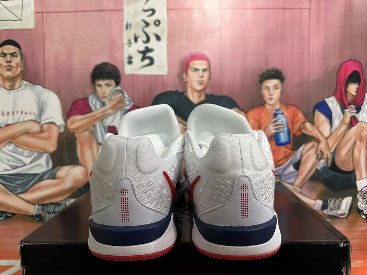 Rear view of white Nike basketball shoes with navy heel details and red outsole accents.