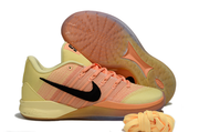 Orange and yellow Nike Sabrina 3 shoe with the patterned outsole visible