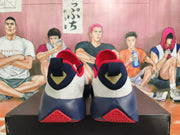 Rear view of white, navy, red, and gold Nike basketball shoes