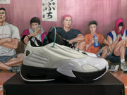 Side view showing the white upper, black outsole accents, and heel air unit