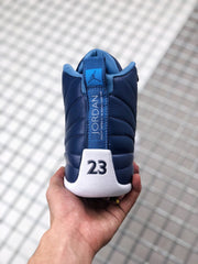 Rear view of the sneaker showing the blue heel strip, Jordan branding, and raised number 23 detail.