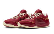 Burgundy Nike KD 16 basketball shoes with cream-colored laces and sole accents.