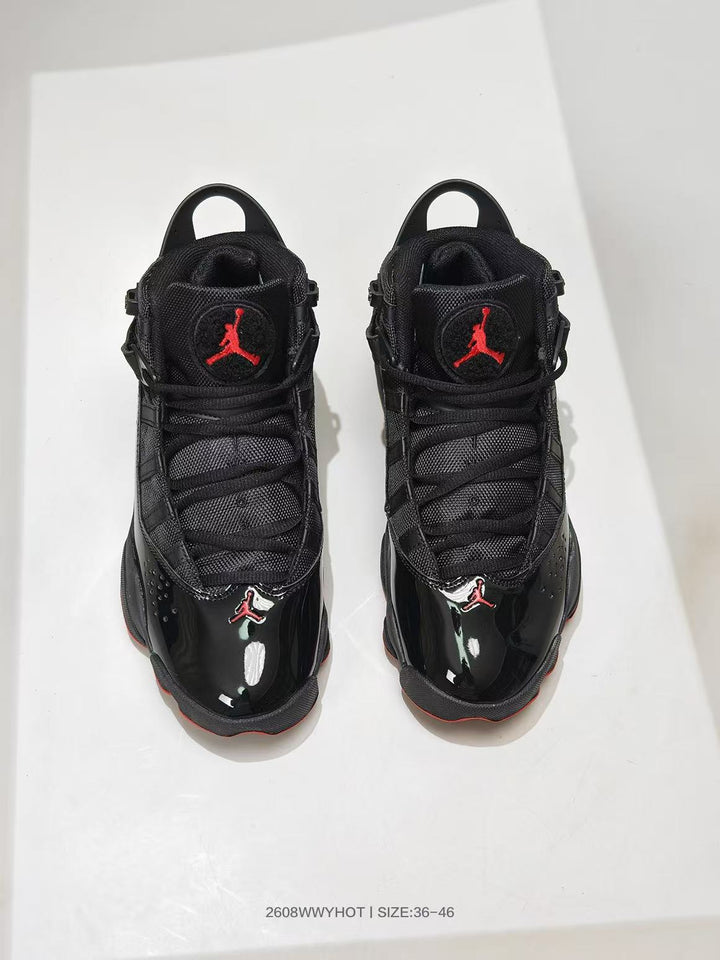 Pair of black and red Jordan 6 Rings-style high-top sneakers viewed from above, with size range text shown at the bottom.