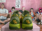 Rear view of green basketball sneakers with yellow heel accents and a sculpted outsole