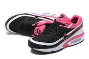 Pair of black, white and pink Nike Air Max BW-style sneakers viewed from above and the side.