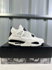 Side profile of a white and black Air Jordan 4 sneaker displayed on a black box.