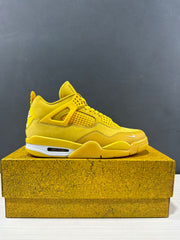 Clean lateral side view of a yellow Jordan Air Jordan 4 sneaker on a textured box.