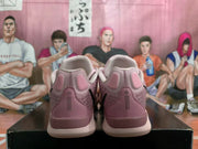 Rear view of a pair of pink basketball shoes showing heel details
