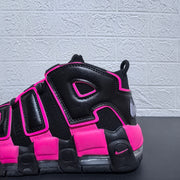 Close-up of the black and pink sneaker side panels
