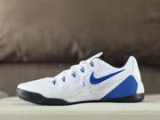 Opposite side view showing the blue Swoosh, white upper and black outsole of the Nike Kobe 9 sneakers.