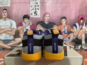Rear view showing the purple heel pull tabs, yellow heel sections, and printed heel details.