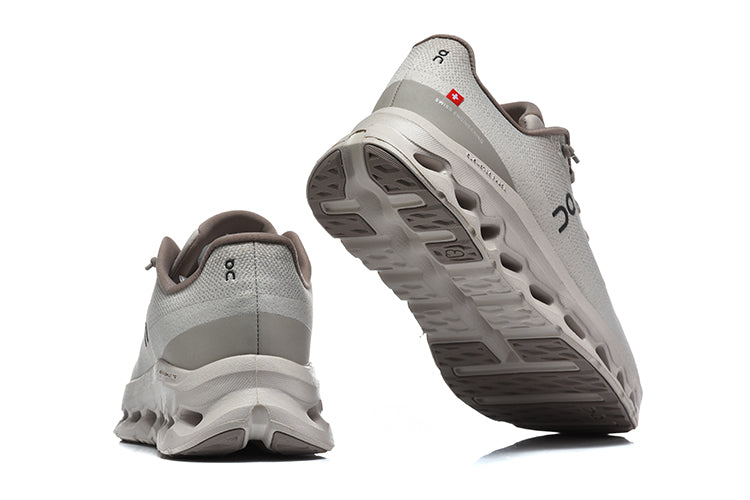 Rear and outsole view of gray On Cloudmonster 3 running shoes