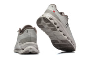 Rear and outsole view of gray On Cloudmonster 3 running shoes