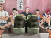 Rear view of the olive green Nike sneakers showing ribbed heel panels and padded collars.