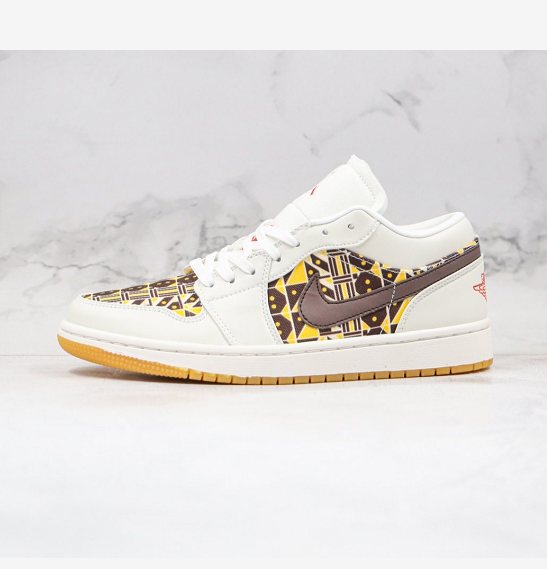Side view of a white low-top sneaker with brown and yellow geometric patterned panels, brown side detailing, and a gum-colored outsole.