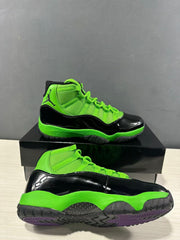 Two black and green high-top sneakers shown from side and outsole angles, with purple traction sections visible.