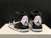 Rear view of the pair showing white heel panels, black branding details, and translucent outsole sections.