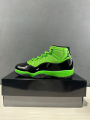 Side profile of a black and vivid green high-top sneaker on a black shoe box.