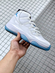 Side view highlighting the white upper, blue outsole, and black collar accent.