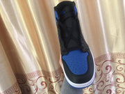 Front view of one sneaker showing the blue perforated toe box, black edging and black laces.