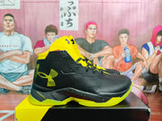 Side profile of a black and yellow high-top basketball sneaker showing the SC side emblem and CHARGED heel marking.