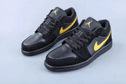 Three-quarter view of the pair showing the black and yellow color blocking.