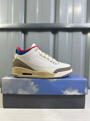 Side profile of a single white Jordan Air Jordan 3 Retro sneaker displayed on the shoebox.