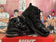 Pair of black high-top sneakers showing glossy side panels and sculpted soles.