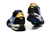 Rear view of the sneakers showing black heel panels and gold heel tabs.