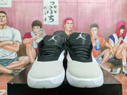 Front view of black and white Jordan basketball shoes with lace-up closure