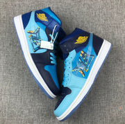 Top-down view of the pair showing the blue and navy color combination, graphic panels and light-blue laces.
